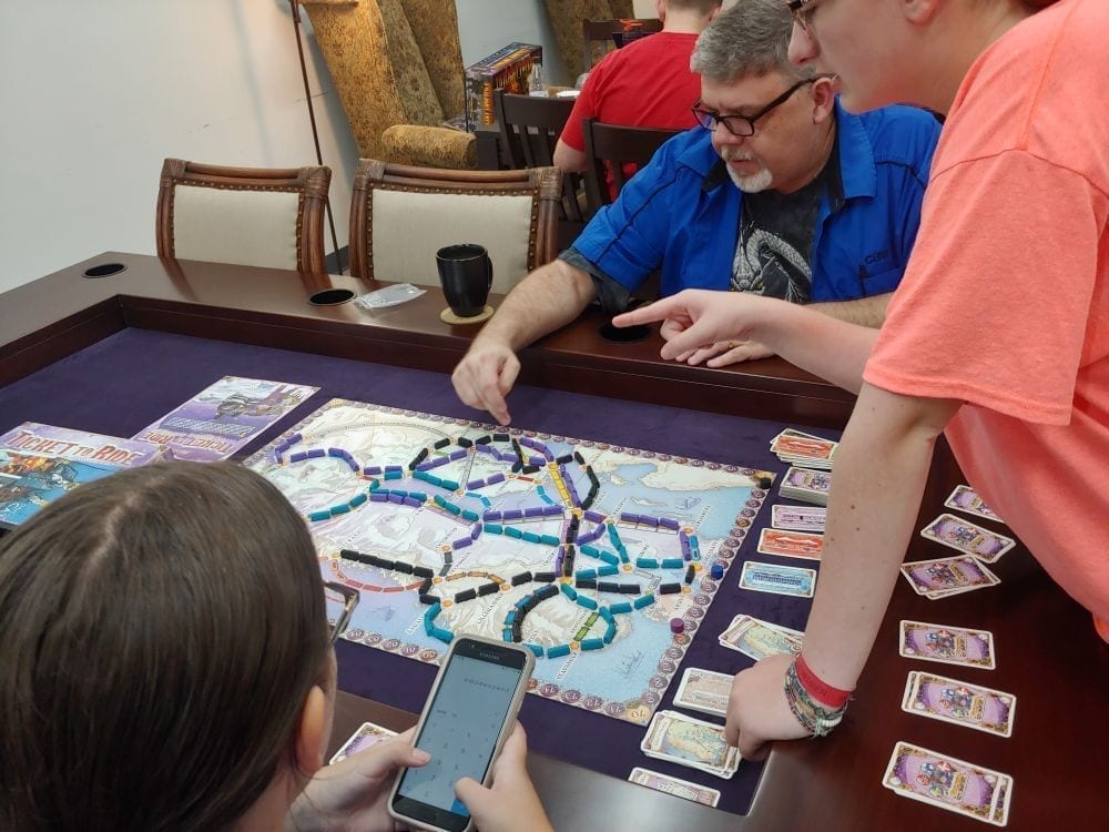 Playing Ticket to Ride on a Banquet Table - Carolina Game Tables